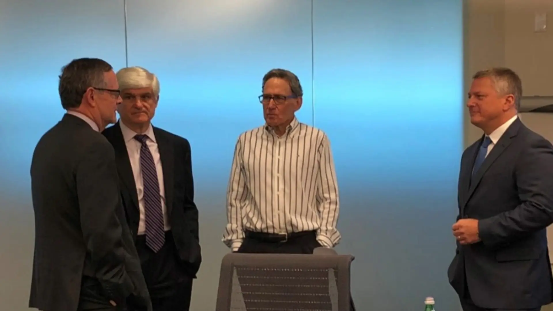 Executive leaders participating in in person leadership coaching session