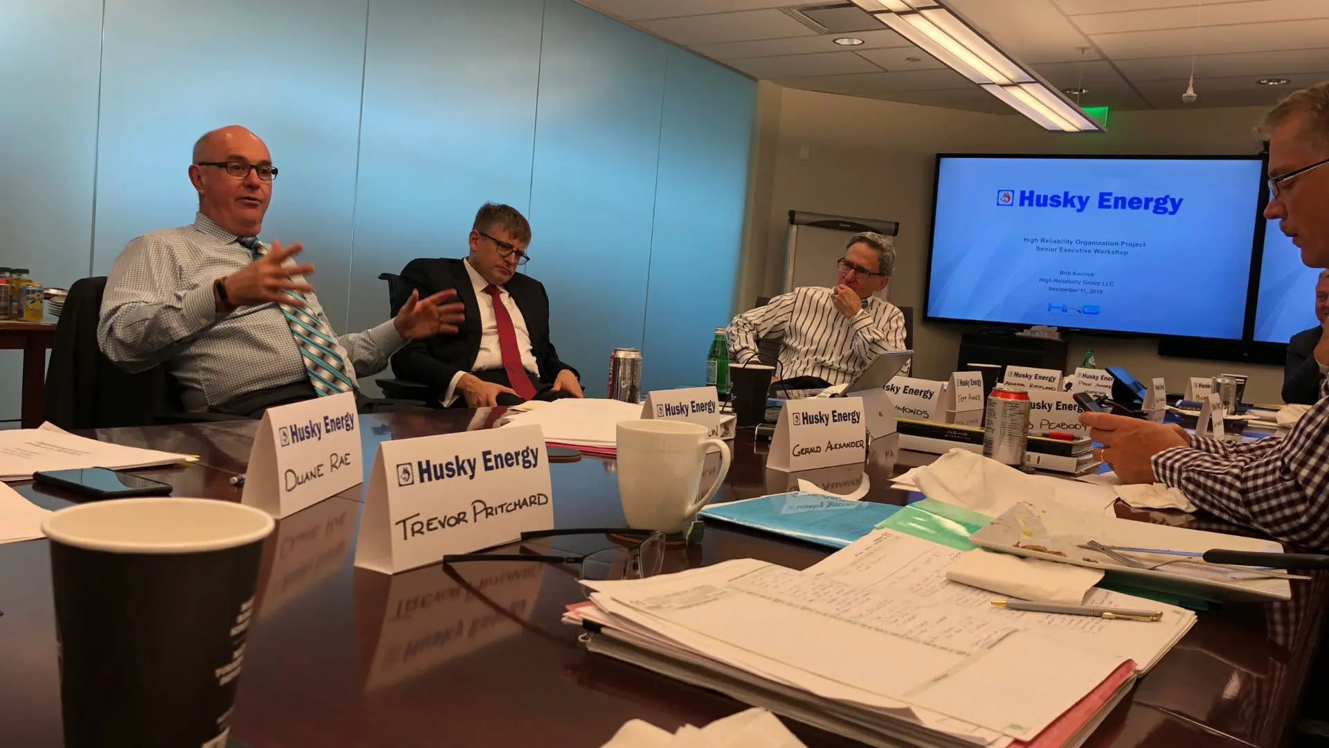 Operational leaders engaged in facilitated reliability workshop discussion